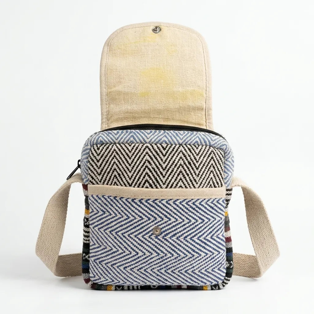 Adjustable natural-coloured woven shoulder strap on the Khojo Yatra flap hemp sling bag