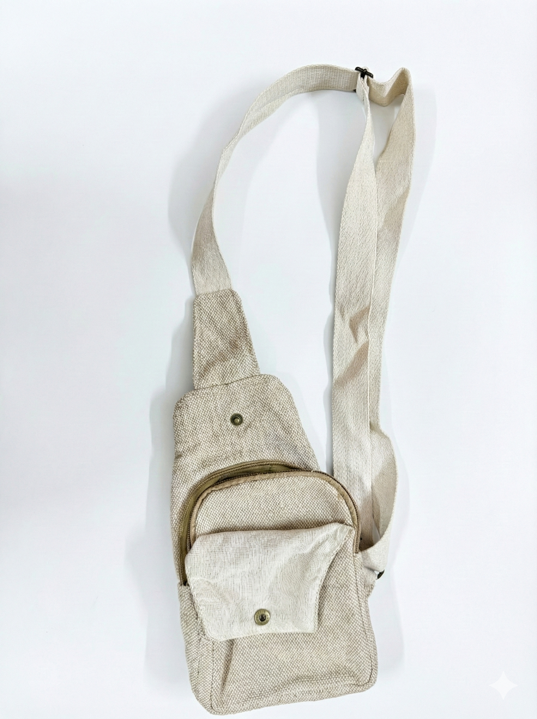 Eco-friendly Himalayan hemp crossbody sling bag with adjustable strap, front zip pocket, and minimalist travel design.