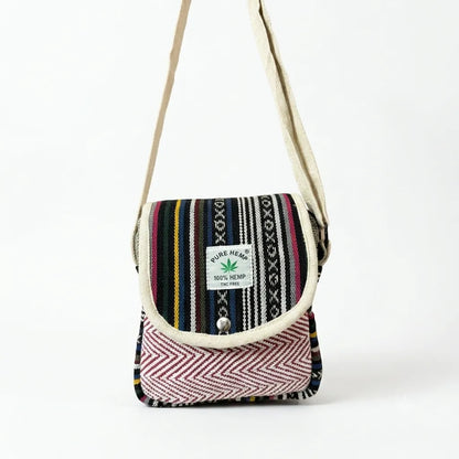 Khojo Yatra hemp sling bag with the flap open, showing the natural beige inner flap and zippered main compartment