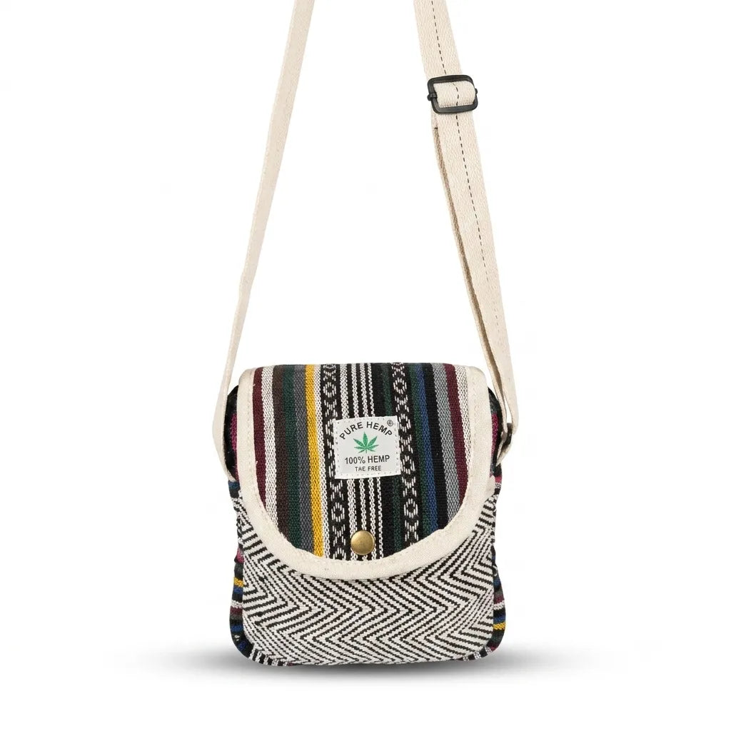 Black-and-white herringbone woven section framing the zip opening beneath the flap of the Yatra hemp sling bag