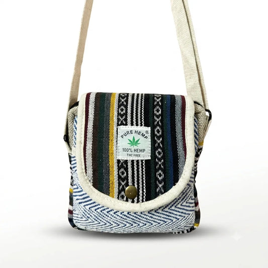 Khojo Yatra flap hemp sling bag, front view, rounded beige-piped flap with multicolour woven stripes and blue-and-white chevron front pocket