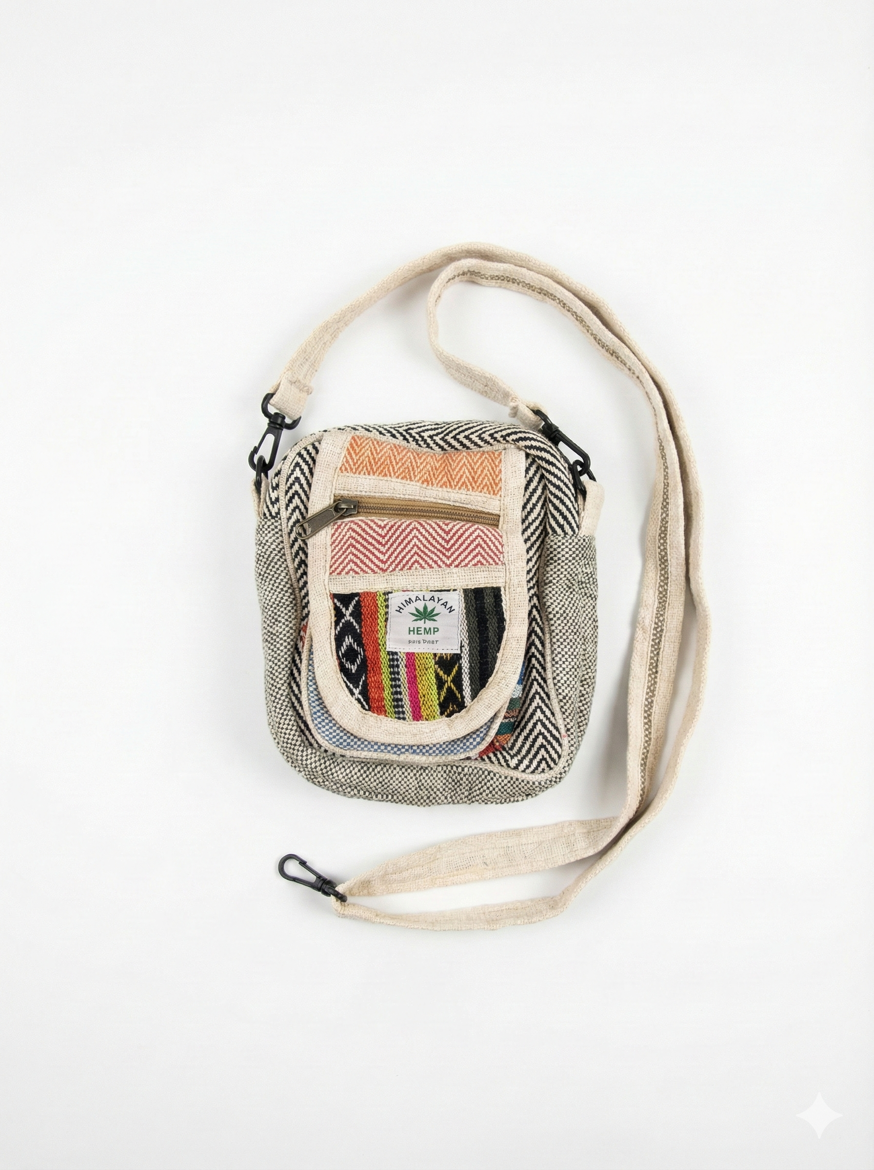 Eco-friendly Himalayan hemp Hululu sling bag with multicolor - Stripped Black ethnic weave, zip pocket, and adjustable crossbody strap for travel.

