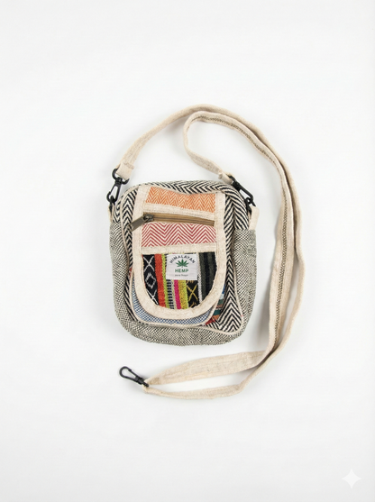 Eco-friendly Himalayan hemp Hululu sling bag with multicolor - Stripped Black ethnic weave, zip pocket, and adjustable crossbody strap for travel.
