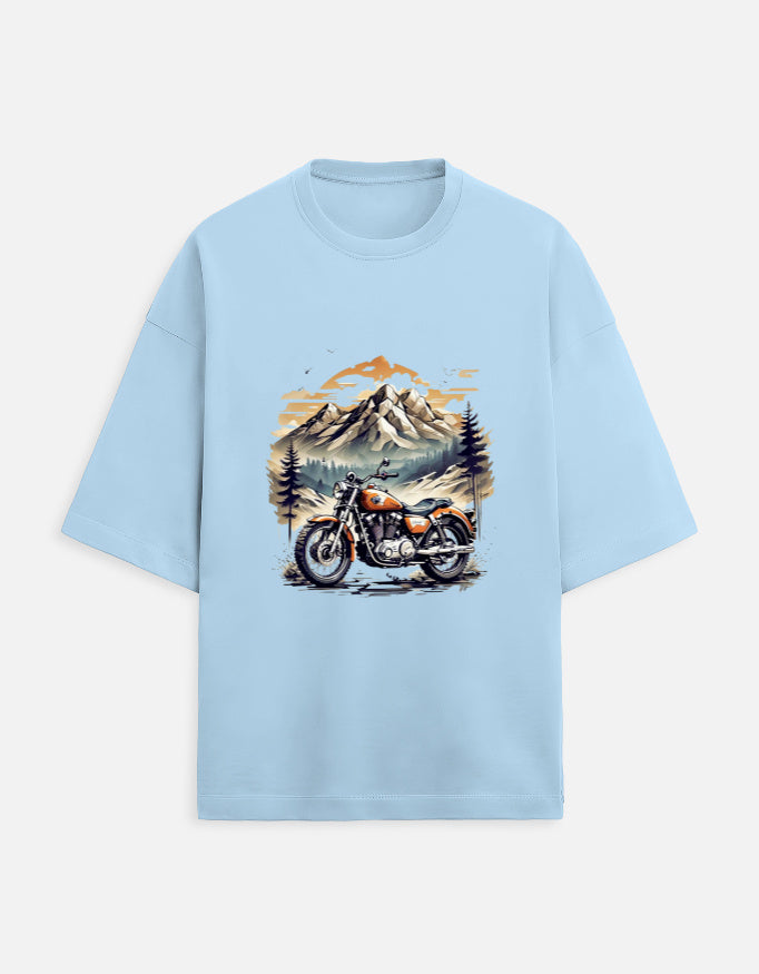 baby-blue unisex terry oversized travel t-shirt with mountain-ride graphic design