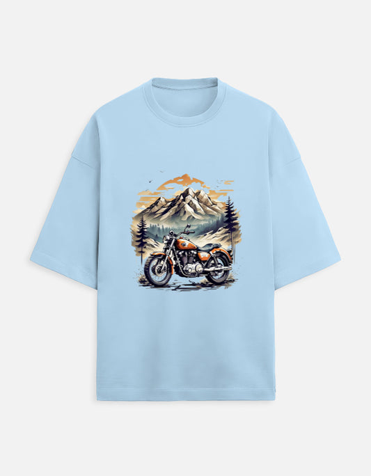 baby-blue unisex terry oversized travel t-shirt with mountain-ride graphic design