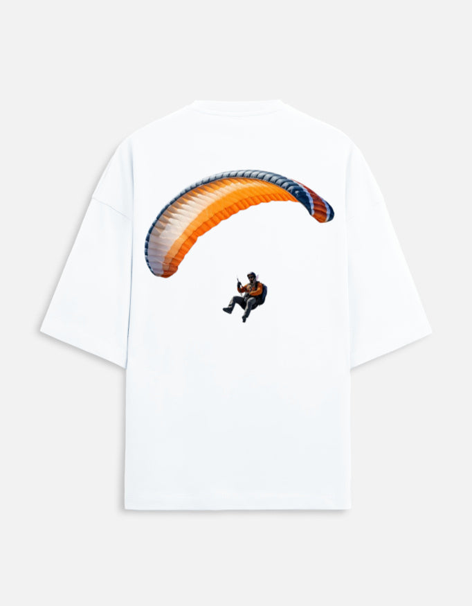 white unisex terry oversized travel t-shirt with para gliding graphic design